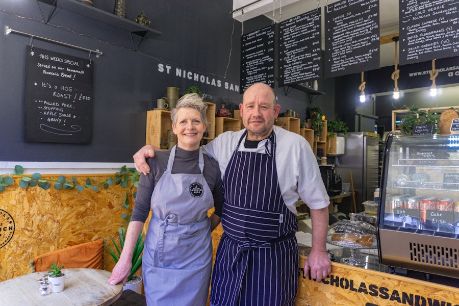 Katrina & Andy owners of St Nicholas Street Sandwich Shop posing inside the shop